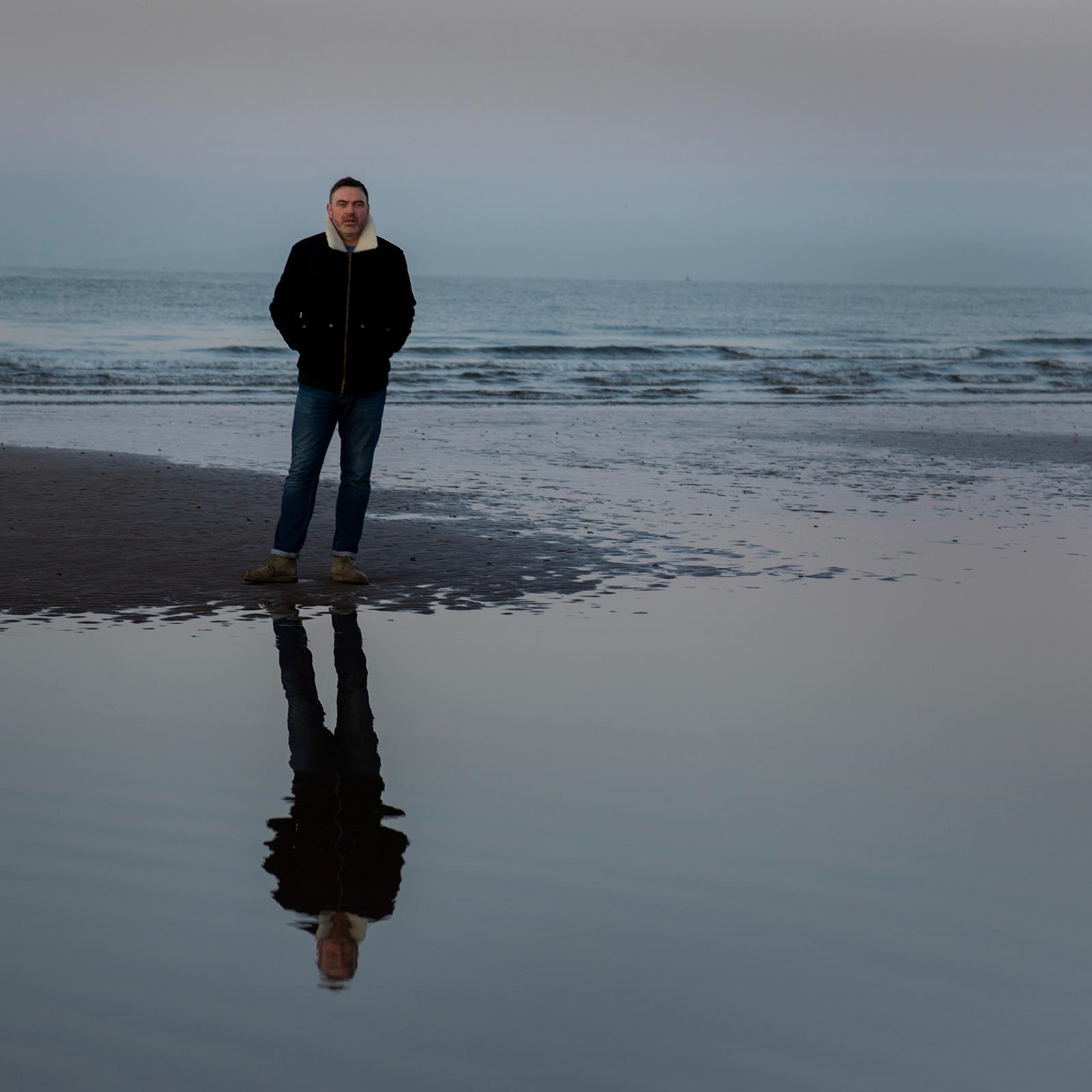 David standing on shoreline